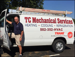 Tim Christopher with one of his heating & cooling service trucks.